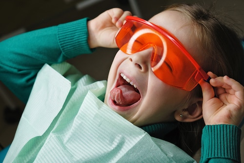 Little Girl In Dental Clinic.